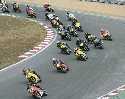 Brands Hatch Indy July 2006.  Everyone piles into and around Paddock Hill Bend.